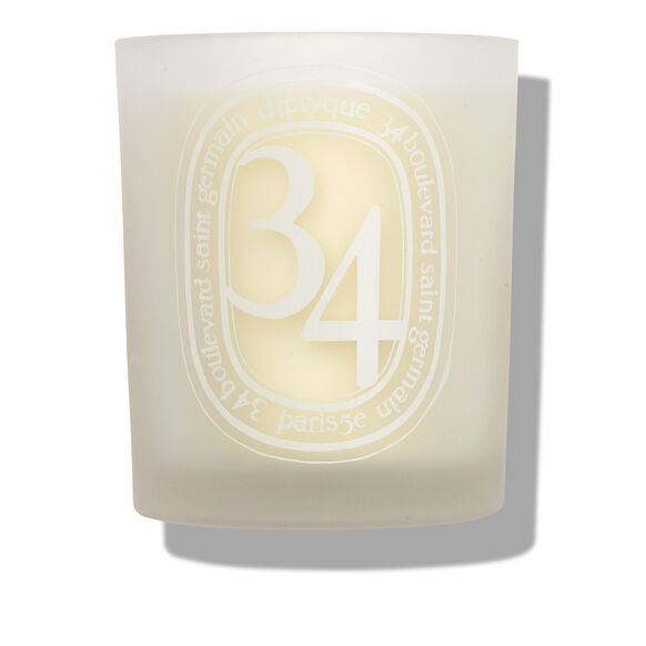 With an evocative scent and a stylish glass jar, the Diptyque 34 Blvd St  Germain Candle is a treat for the senses both lit and unlit. | Space NK